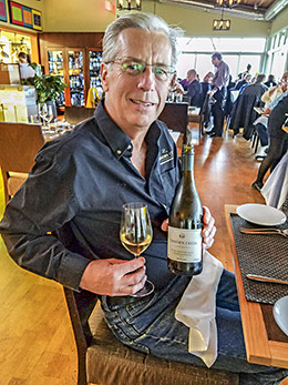 Kenn Oldfield, Chairman of Tinhorn Creek Vineyards shows off his award winning chardonnay during dinner at Miradoro Restaurant at Tinhorn Creek Vineyards.