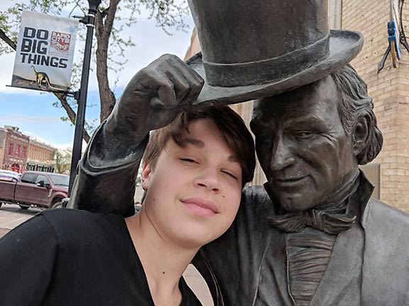 Iden Elliott with statue of James Monroe