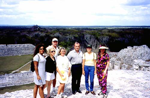 People standing atop the pyramid at Edzna