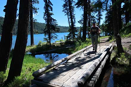 Crossing a footbridge alongside Miller Lake