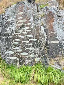 Greenland Qaqortoq carved man and faces on stone